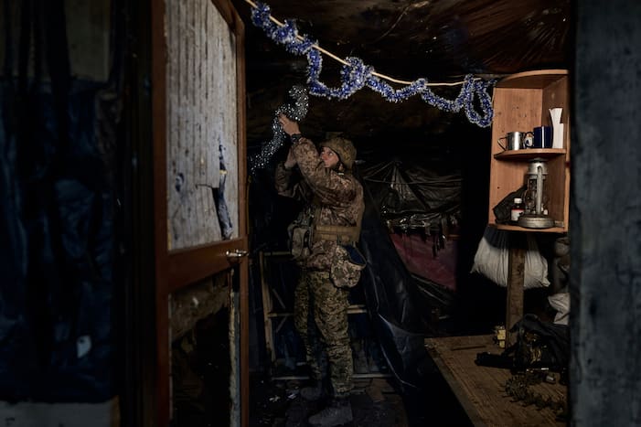 A Ukrainian soldier decorates a frontline position during fights with Russian forces near Maryinka, Donetsk region, Ukraine (AP Photo)