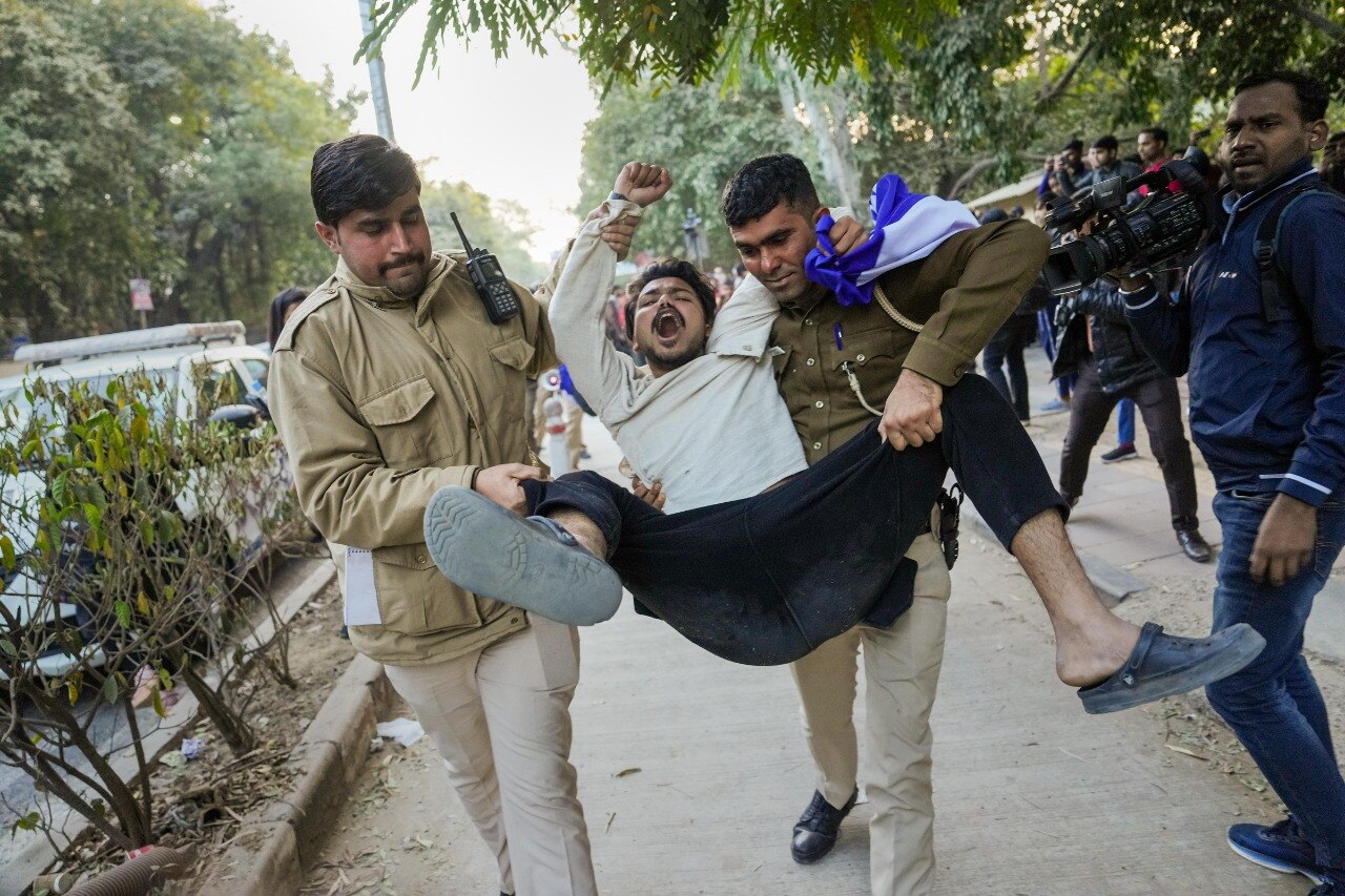 Police personnel detain members of Bhim Army Student Federation for planning to screen BBC documentary at Delhi University campus. Photo: PTI