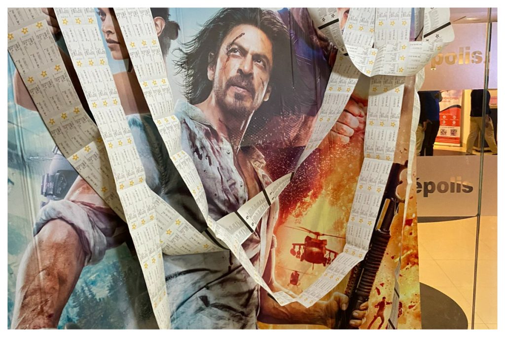 Shah Rukh Khan's Reply To Pathaan Poster Garlanded With Its Tickets Is Shah Rukh Khan's Reply To Pathaan Poster Garlanded With Its Tickets Is