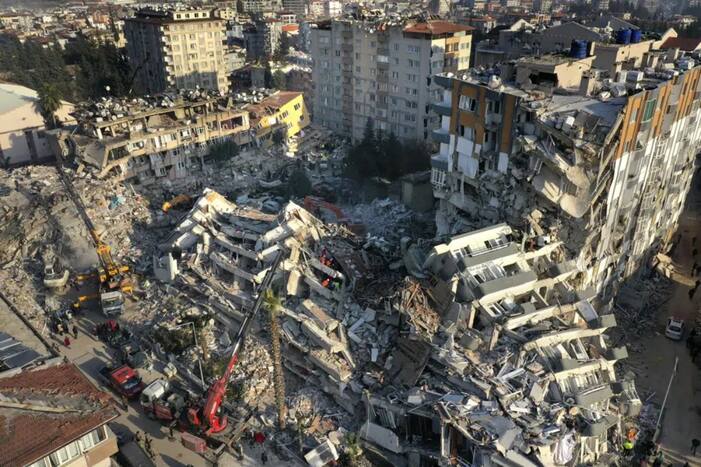 Rescue teams search for people as cranes remove debris from destroyed buildings in Antakya, southeastern Turkey