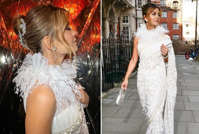 Natasha Poonewalla graciously attends the Crown to Couture exhibit in elegant white saree