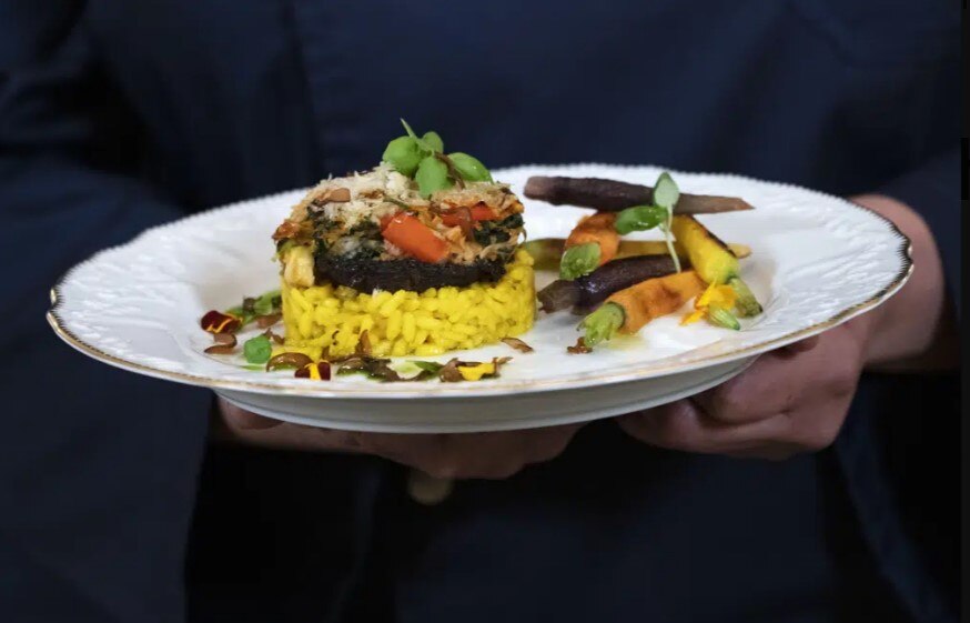 A chef will serve the main course, stuffed portobello mushrooms with a creamy saffron risotto, which will be served at the state dinner with India on Thursday night, during a media preview, Wednesday, June 21, 2023, at the White House in Washington.  (AP photo)