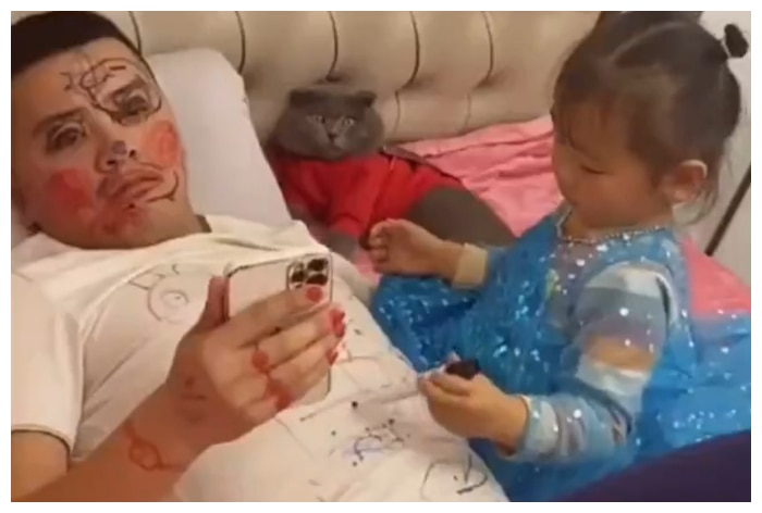 Little Girl Uses Dad’s Face And T-Shirt As Canvas, Watch The Result