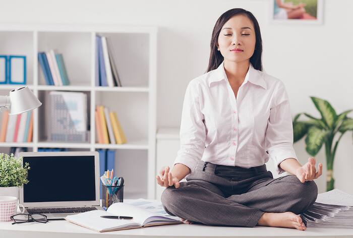 5 Easy Yoga Poses That You Can Do From Your Work Desk