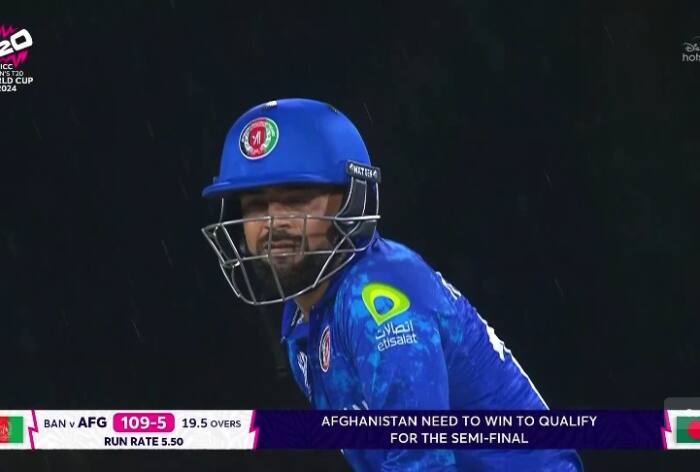 Rashid Khan, Rashid Khan angry, Rashid Khan angry at Karim janat, Rashid Khan throws bat at Karin Janat, Rashid Khan vs Bangladesh, Rashid Khan in T20 World Cup 2024, T20 World Cup 2024, Afghanistan vs Bangladesh, Afg vs BAN, Afghanistan vs Bangladesh in T20 World Cup 2024, Rashid Khan news, Rashid Khan updates,