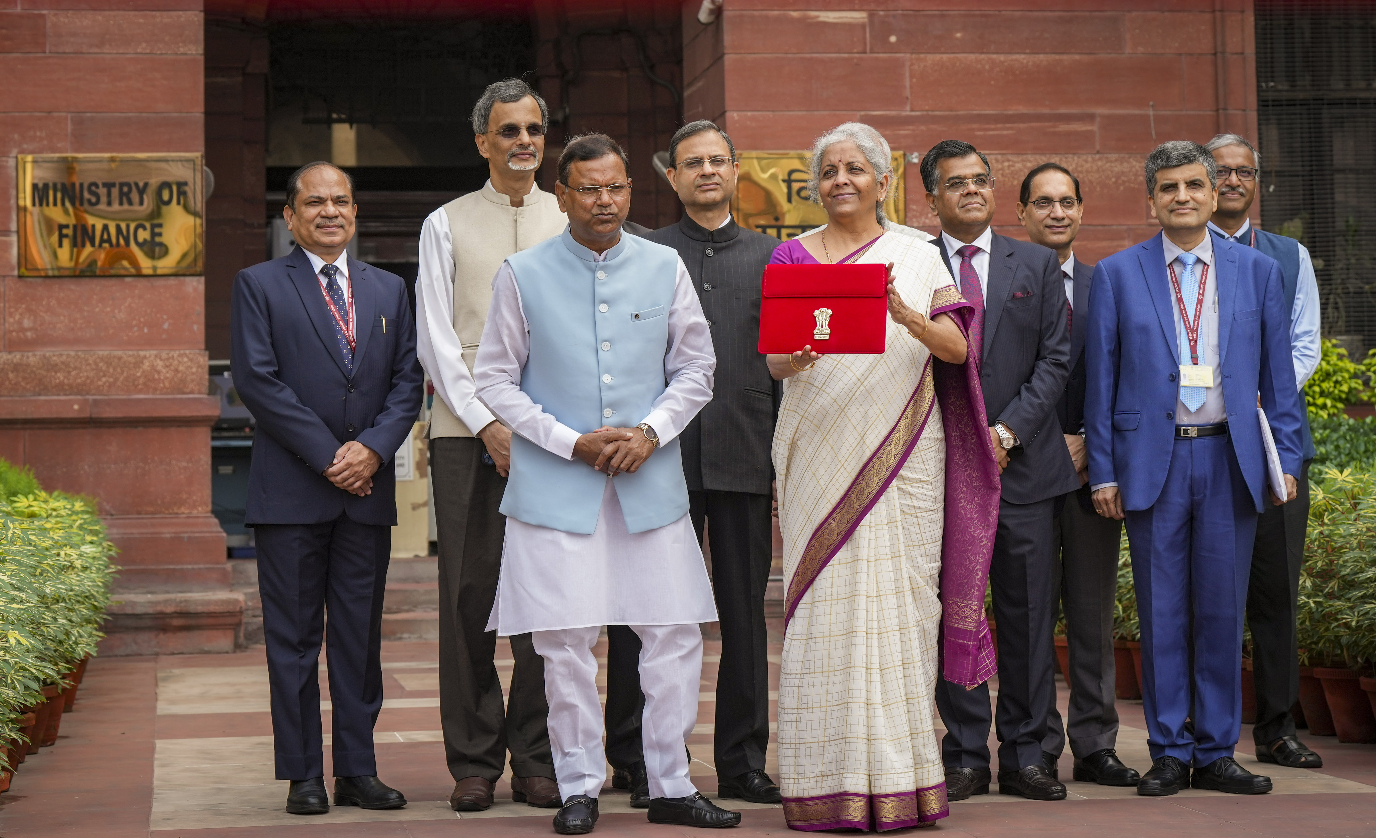 FM Nirmala Sitharaman Drapes Elegance in Off-White Checkered Handloom Saree With Purple-Golden Border