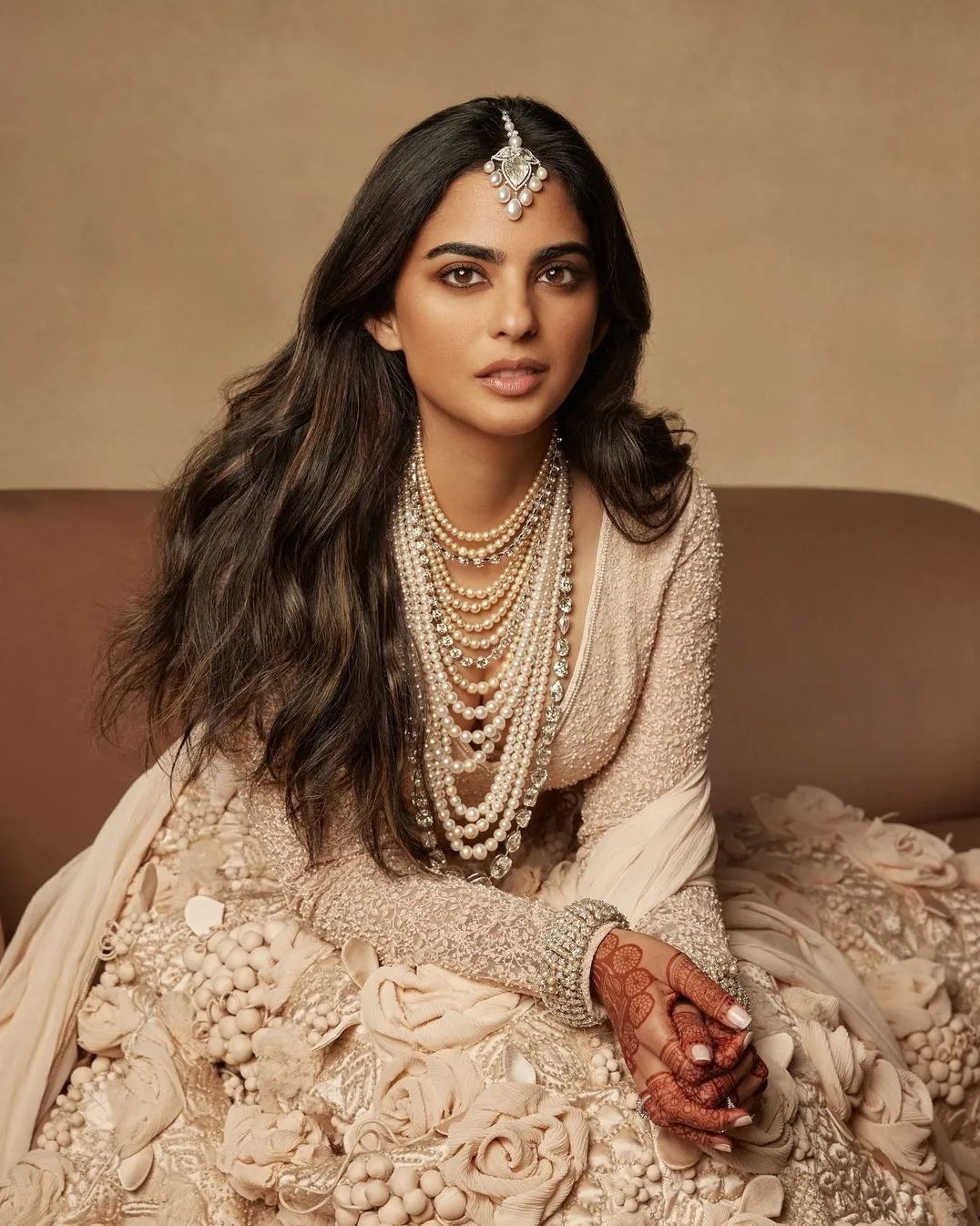 Isha Ambani wears layers of pearls with beaded statement blouse.