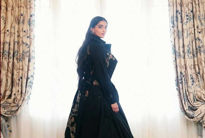 Sonam Kapoor exudes majestic grace in Dior’s dramatic black dress with English floral motif and hint of tradition at Paris Fashion Week