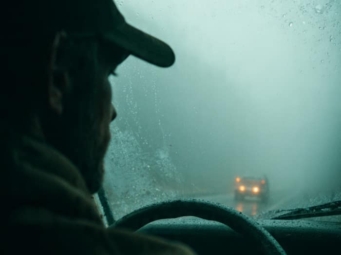 Car driving in fog