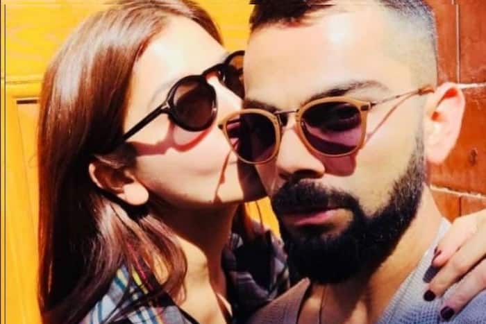 Virat Kohli gets a special kiss from Anushka Sharma as RCB lift IPL trophy - See pic