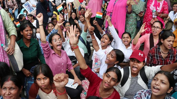 What is happening in Jantar Mantar after Dharmendra Pradhan announces resignation?