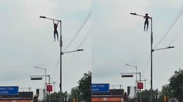 Kolkata man hangs from towering lamp post, performs pull-ups over busy road