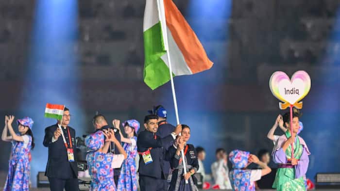Pawan Sehrawat and Manu Bhaker wave India's flag